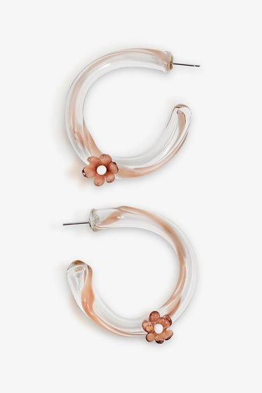 Pair of hoop earrings with floral accents on a white background