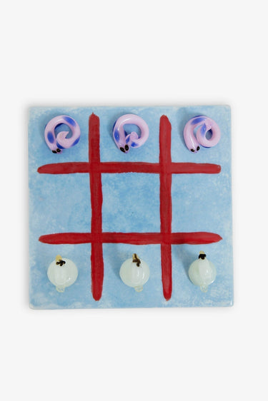 Tic-tac-toe game with animal figurines on a blue background