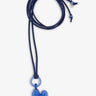 Blue heart-shaped pendant on a dark blue cord against a white background